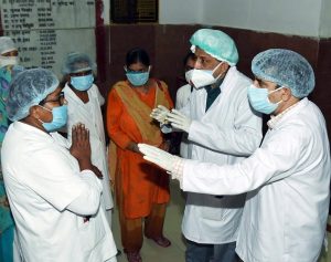 Patna Medical College and Hospital's nursing staff speaking to Bihar Health Minister Mangal Pandey as they protest over various demands in Patna on Friday. (ANI Photo)