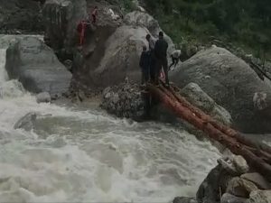 A foot bridge in Chamoli, Uttarakhand got washes away due to heavy rains. [Photo/ANI]